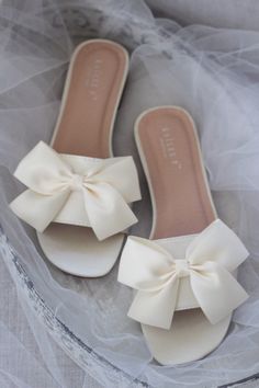 "Classic slide flat sandals for casual and dressy look with added SATIN BOW. Simple and easy wear for brides, bridesmaids and/ or wedding parties. DETAILS: COLORS AVAILABLE: White, Off White and Ivory UPPER: Synthetic upper and lining MATERIALS: Mandmade outsole - Please see our \"Policies\" section for information regarding RETURNS and EXCHANGES. - Stay updated with latest news or promotion as we grow and follow us on the following outlets: Instagram: http://instagram.com/shop.kaileep Facebook: Bridesmaids Sandals, Sepatu Pump, Bridesmaid Sandals, Fancy Sandals, Sandals Wedding, Pretty Sandals, Fashion Shoes Heels, Shoes Heels Classy