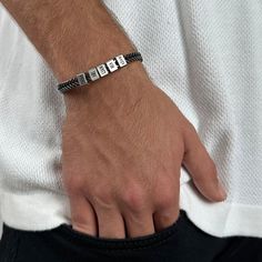 "This simple and beautiful stylish men's stainless steel bracelet comes with with 5 custom stainless steel beads, each with an inscription of its own. The bracelet comes with 5 beads, you can decide which to personalize and the rest will remain empty. ITEM DETAILS: * Waterproof and Sweatproof. * Font color: Black * Bracelet length: 7\" (18cm). * Bracelet comes with a 2\" (5 cm) extension chain. * Please mention your font preference when ordering Every purchase comes packaged in a sweet box. It c Modern Bracelets For Father's Day Gift, Custom Name Adjustable Chain Bracelet For Anniversary, Adjustable Chain Bracelet With Custom Name For Anniversary, Modern Bracelet For Father's Day Gift, Custom Name Chain Bracelet For Anniversary, Personalized Adjustable Sterling Silver Bracelet, Jubilee Bracelet In Stainless Steel For Friendship, Adjustable Custom Text Jewelry For Everyday Wear, Adjustable Everyday Jewelry With Custom Text