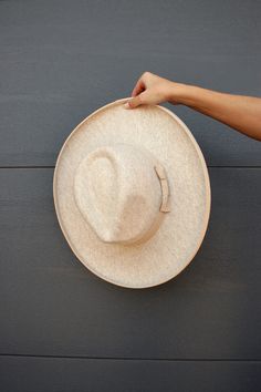 This gorg oatmeal hat goes with everything and is extremely elevated! It's such a good high quality material and has an adjustable string inside to fit everyone! A closet staple if you ask me! Heather beige and nude Adjustable inside string Fedora hat style Bow detail Lifted edge of brim True to size One size Cream Fedora Hat One Size Fits Most, Cream Fedora With Adjustable Short Brim, Adjustable Cream Fedora With Short Brim, Adjustable Cream Fedora Panama Hat, Wide Brim Beige Panama Hat For Winter, Cream Brimmed Adjustable Panama Hat, Summer Cream Felt Hat With Curved Brim, Adjustable Cream Fedora Felt Hat, Cream Adjustable Flat Brim Fedora