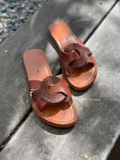 These unique sandals were handmade made in Morocco; I etched them free-hand with a henna inspired design!  Hi! My name is Merche and I've been a henna artist since 2013. I discovered my skills are transferable to another awesome form of art...leather pyrography! As each pattern is drawn freehand, every shoe is slightly unique and one-of-a-kind. All patterns are Merche Mariposa originals, designed by me!  Have an excellent idea of your own? Send me a message. I absolutely love custom orders! www. Bohemian Leather Sole Sandals For Festivals, Bohemian Hand Tooled Huarache Sandals For Beach, Artisan Hand Tooled Open Toe Huarache Sandals, Brown Bohemian Sandals With Leather Sole, Bohemian Brown Huarache Sandals With Single Toe Strap, Brown Bohemian Huarache Sandals With Single Toe Strap, Bohemian Brown Toe Loop Sandals, Bohemian Closed Toe Brown Barefoot Sandals, Bohemian Huarache Sandals With Toe Loop