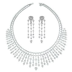 An enchanting necklace & earring suite is ideal for the red carpet, a gala or a royal wedding. The luxurious combination of hearts, ovals and rounds is breathtaking and show stopping.  Diamonds Shapes: Heart, Round, Marquise & OvalCenter Solitaire: 1.08 ct Heart Shape GH color SI ClarityTotal Diamond Weight: 51 White Gold Heart Necklace, Bridal Diamond Necklace, Necklaces Choker, Vintage Choker Necklace, Diamond Cluster Earrings, Gold For Sale, Fancy Necklace, Vintage Choker, Hearts Necklace