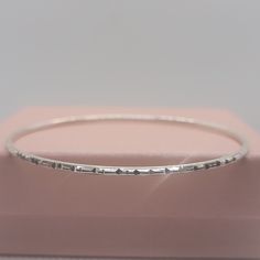 Elevate your style, your outfits, and your jewelry collection with this handmade solid S925 sterling silver diamond cut bangle bracelet. This stunning piece features intricate detailing that will make showcases craftsmanship, adds beauty to any outfit, and makes it a perfect gift. Please check out the chart in the photos to know your size. ◾D E T A I L S◾ ▪M A T E R I A L: This bangle bracelet is all handmade with care with the highest and bestest quality silver ▪D E S I G N: The design on this bangle bracelet it intricate, unique, and absolutely stunning and it is accomplished by diamond cuts.  ▪WHY YOU'LL LOVE IT: This unique sterling silver bangle bracelet is more than just a piece of jewelry; it's a statement of style and charm. The diamond cut design it stunning and gorgeous. Its beau Sterling Silver Stackable Round Bracelet, Stackable Sterling Silver Bracelet For Anniversary, Stackable Sterling Silver Bracelet, Stackable Round Sterling Silver Bracelet, Anniversary Sterling Silver Bangle With Silver Clasp, Minimalist Sterling Silver Hallmarked Bracelet As Gift, Dainty Sterling Silver Bangle In Silver, Dainty Silver Engraved Bracelets, Dainty Engraved Silver Bracelet