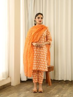 Anita - Orange Mirror Embroidered Printed Kurta Set (Set of 3) By Gulabo Jaipur now available at Trendroots Orange Chikankari Embroidery Palazzo Set For Diwali, Diwali Orange Chikankari Embroidery Palazzo Set, Designer Chanderi Kurta With Printed Motifs, Designer Orange Straight Kurta, Designer Wear Orange Kurta, Traditional Drape Cotton Palazzo Set, Navratri Orange Chikankari Palazzo Set, Orange Kurta With Printed Motifs For Diwali, Unstitched Orange Kurta With Gota Work