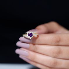 Product Details Sparkle with this Amethyst and Diamond Ring jewelry. It features Heart Shape Amethyst and is beautifully embellished with Diamond Accent in Prong Setting on Amethyst Heart Ring. Crafted in Solid Gold. Gift your woman this unique Amethyst Diamond Engagement Ring on her special day. Product Information SKU SHP-RINGS0821192750 Width 5 mm Height 9.8 mm Weight 2.02 gm (Approximate) AMETHYST INFORMATION No.of Stones 1 Pieces Total Weight 0.90 Carat (Approximate) Dimension(approx) Heart Amethyst Engagement Ring, Amethyst Ring Engagement, Amethyst Heart, Amethyst And Diamond Ring, Ring With Diamond, Signature Jewelry, Gold Gift, 18k Yellow Gold Ring, Jewelry Rings Diamond