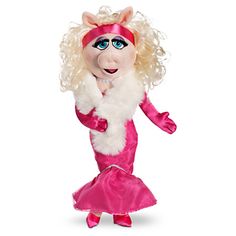 the miss piggy doll is wearing a pink dress and white fur stole with her hands on her chest