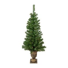 a small christmas tree in a pot on a stand