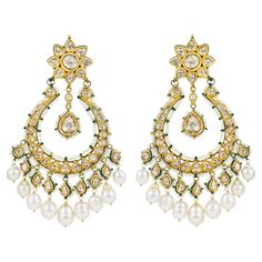 A pair of earrings handcrafted in 22K gold with diamond polkis at the front. These type of earrings are also know as chand Balis due the shape of the lower hangings which are in form of crescent shape moons. The studs are in form of 8 petal flower which are hanged with large roundish moons hanged with Polki drops below which has further south sea pearls attached to them. The earrings are big and heavy in size therefore comes with gold clips and push so that ears are comfortable while wearing them. These chandbalis are enamelled at back with green colour and having highlights of gold colour showcasing the beauty of the flower buds. The enamel is a testament to the purity of gold used in these earrings and the fine quality of craftsmanship that has been done in Jaipur in these earrings. Thes Luxury Meenakari Chandbalis, Luxury White Meenakari Chandbalis, Luxury Gold Meenakari Chandbalis, Cheap Bollywood Chandbalis For Festive Season, Luxury Chandbali Cut Dana Jewelry, Cheap Traditional Chandbali Jewelry, Luxury Kundan Chandbali Tikka, Affordable Bollywood Chandbali Jewelry, Luxury Temple Jewelry Chandbalis For Party