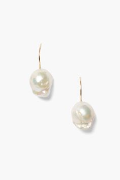 An essential piece you'll reach for everyday, this drop earring features a white baroque pearl drop on a 14k gold French hook. Pair with dainty gold earrings to perfect the layered look. Baroque pearls are one of a kind so size and shape may vary. 14k yellow gold. 1 1/8" drop. Handmade in Vietnam. Pearl Drop Earring, Baroque Earrings, Keshi Pearl Earrings, Diamond Charm Necklace, Keshi Pearl Necklace, Dainty Gold Earrings, Elegance Wedding, Coastal Elegance, Gold Hamsa