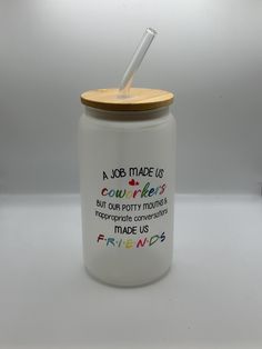 a jar with a straw in it that says a job made us courredies