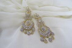 Check out this item in my Etsy shop https://www.etsy.com/listing/1203099004/gold-silver-indian-earrings-jewelry Elegant Bridal Earrings With Stone Work For Reception, Elegant Stone Work Bridal Earrings For Reception, Elegant Bridal Earrings With Stone Work In Cubic Zirconia, Glamorous Sterling Silver Chandelier Earrings For Wedding, Glamorous Sterling Silver Wedding Chandelier Earrings, Elegant Round Chandelier Earrings For Reception, Elegant Wedding Chandelier Earrings With Stone Work, Elegant Chandelier Earrings With Stone Work, Elegant Bridal Earrings With Stone Work For Party