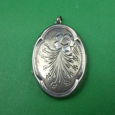 Description : A large vintage sterling silver Stylic oval locket with stylised floral engraved decoration to the front. Marks : Marked Silver and Stylic. Weight : It weighs 7.1 grams. Size :  3.7cm long, 2.5cm wide. Condition : In very good condition.   FREE UK POSTAGE. Vintage Sterling Silver Engraved Locket Necklace, Vintage Engraved Sterling Silver Locket Necklace, Antique Sterling Silver Etched Locket Necklace, Antique Etched Sterling Silver Locket Necklace, Vintage Silver Medallion Locket Necklace, Silver Vintage Medallion Locket Necklace, Vintage Engraved Oval Pendant Locket Necklace, Vintage Silver Oval Pendant Locket Necklace, Vintage Engraved White Gold Locket Necklace