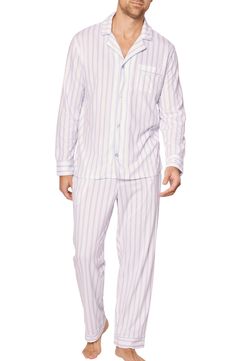 Timeless stripes keep things crisp in cozy pajamas made of buttery-smooth pima cotton designed to soften after each wash and resist fading. Top has front button closure; notched collar; long sleeves; chest patch pocket Bottoms have elastic/drawstring waist 100% pima cotton Machine wash, dry flat Made in Peru