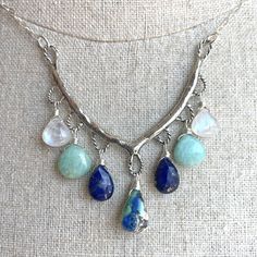 An heirloom piece. The artisan work on this solid sterling silver piece is just gorgeous. I have added a focal Arizona lapis turquoise, lapis lazuli, amazonite, and rainbow moonstone wired in sterling silver to sterling silver chain with a 4" extender with lapis on the end. This necklace can be adjusted from 16" to 20". There is a very limited quantity available, so if you love it, don't wait! The focal stone will be unique for each piece but the other stones used are fairly uniform. Your neckla Bohemian Sterling Silver Jewelry For Healing, Spiritual Sterling Silver Jewelry With Gemstone Beads, Silver Chrysocolla Jewelry With Gemstone Beads, Sterling Silver Gemstone Beads Jewelry For Healing, Healing Sterling Silver Gemstone Beads Jewelry, Healing Sterling Silver Jewelry With Gemstone Beads, Bohemian Sterling Silver Jewelry With Gemstone Beads, Spiritual Turquoise Necklace With Natural Stones In Sterling Silver, Bohemian Turquoise Gemstones In Sterling Silver