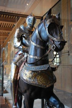 a statue of a man in armor on a horse