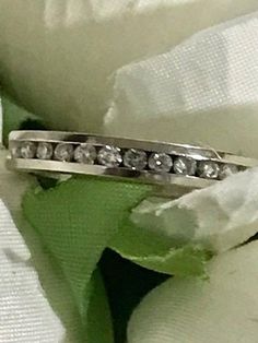 14K White Gold Engagement/Wedding Diamond Set Rings Mid-Century Princess Cut Approx. .83 CTW Size 6 3/4 Ring has 9 Diamonds. The center one is a princess cut and has .05 carats. the two besides that one has .03carats each and then the three smaller ones on each side (6) has .02 carats. Pictures doesn't do it justice! Size: 63/4 almost 7 and can be re-sized to fit by your local jeweler. Excellent Estate condition. Round Princess cut Color approx: H-I Clarity approx: SI1 Approx: 0.58 carats Total Silver Half Eternity Diamond Ring For Marriage, Half Eternity Diamond Ring For Marriage, Wedding Diamond Ring With Channel Set, Silver Half Eternity Wedding Band, Silver Half Eternity Band For Wedding, Silver Channel Set Eternity Wedding Band, Classic Channel Set Eternity Band For Weddings, Wedding Rings Platinum Channel Set, Silver Wedding Bands Channel Set