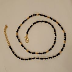 Beautiful Black And Gold 24" Necklace By Bellezza. In Preowned But Unworn Condition, So Nwot (New Without Tags). Made In Italy (Itaor). Faceted Black Spinel Beads With Gold Beads Shimmer! Lobster Claw Clasp. Measures 24" Plus 2.5" Extender. Adjustable Black Necklace With Gold Beads, Black Beaded Necklace With Gold Beads As Gift, Black Necklaces With Round Gold Beads, Black Single Strand Beaded Necklaces For Party, Black Single Strand Beaded Necklace For Party, Party Black Single Strand Beaded Necklace, Black Beaded Necklace With Gold Beads For Party, Black Single Strand Necklace For Party, Elegant Black Beaded Chain