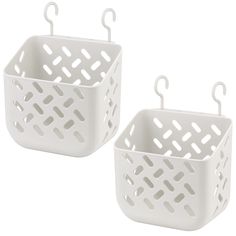 two white plastic baskets sitting next to each other