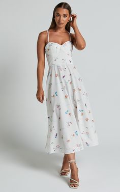 Make a statement in our Robertson Midi Dress - Strappy Sweetheart Bustier Flare Dress In Painterly Wild Flower! This stunning white dress is perfect for any party or day event. The sweetheart neckline adds a touch of femininity, while the midi length and fit & flare silhouette create a flattering shape. Made from poplin polyester, this dress is not only comfortable but also easy to care for. Whether you're heading to a wedding or brunch with friends, our Robertson Midi Dress will have you lo Dresses For The Races, Clothing Inspiration, Wild Flower, Poplin Fabric, Fit Flare Dress, Fit & Flare, Sweetheart Neckline, Flare Dress, Polyester Material