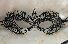 Black Lace Masquerade Mask with Gold Glass Diamantes Black Double 6mm Satin Ribbons each side (Approx 1m) to secure your Mask or Gold Double 6mm Satin Ribbons (Please let me know when ordering your Mask what colour Ribbons you would prefer)  Comfortable to wear all Evening Complete with Silver Organza Carry Bag Measures: 8.5" by 3" Approx and will fit most Adults Beautiful Mask for any Special Occasion Masquerade Balls New Year's Eve Party Christmas Party Proms Weddings Halloween Parties https:/ Fitted Black Masquerade Mask For Mardi Gras, Fitted Black Masquerade Mask For Costume, Black Masquerade Mask For Halloween Wedding, Fitted Black Masquerade Mask For Carnival, Fitted Black Masquerade Mask For Halloween, Fitted Masquerade Mask For Mardi Gras Costume Party, Fitted Masquerade Mask For Halloween Costume Party, Halloween Masquerade Mask For Costumes, Gothic Masks For Carnival Party