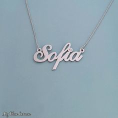 Order any single name or word, for your new 14k White Gold Sofia style name necklace!  If you would like to add Genuine Swarovski Birthstone for the dot of the i, or the first capital letter, choose this option in the menu provided. * Nameplate and chain are all Solid 14k White Gold. Stamped 14k for authenticity. * First capital letter is exactly 11mm (0.4 inches). Standard Size name necklace. * Nameplate is 0.8 high quality thickness, or my double premium upgraded 1.1mm thickness. * In the lead Classic White Gold Name Necklace As Gift, Dainty 14k Gold Custom Necklace In Silver, Dainty 14k Gold Necklace In Silver Color, Silver Custom Necklace In Dainty Style, Fine Jewelry Name Necklace For Formal Occasions, Customizable Sterling Silver Necklace For Formal Occasions, Customizable Sterling Silver Necklaces For Formal Occasions, Silver Name Necklace With Initial Pendant, Fine Jewelry Silver Name Necklace With Initial Pendant