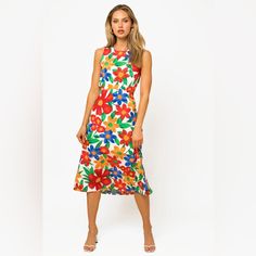 This Midi Dress Features A Vibrant Tropical Floral Print, Perfect For A Fun And Girly Look. The Crew Neckline And Sleeveless Design Provide Comfort, While The Elasticized Waist Creates A Flattering Fit. The Open Back With Button And Lace Down Closure Adds An Eye-Catching Detail. Lined For Coverage, This Non-Stretchy Dress Is Cute And Playful. Materials 100% Polyester Lining: 100% Polyester Made In Guatemala Medium: Length: 50", Bust: 28" True To Size Multicolor Tropical Print Midi Dress For Day Out, White Summer Dress With Vibrant Print, White Dresses With Vibrant Print For Summer, White Vibrant Print Summer Dress, Tropical Multicolor Midi Dress With Floral Print, Tropical Floral Print Midi Dress For Brunch, Sleeveless Multicolor Tropical Print Midi Dress, Sleeveless Multicolor Midi Dress With Tropical Print, Red Floral Print Midi Dress For Garden Party