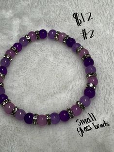 This bracelets is beautifully made with purple and lavender colored small glass beads. It is spaced with silver rhinestone accents and will look beautiful on any wrist. Small Beads Bracelets Ideas, Adjustable Purple Beaded Bracelets With Round Beads, Adjustable Purple Beaded Bracelets, Purple Bracelets With Spacer Beads, Purple Beaded Bracelets With Spacer Beads As Gift, Purple Beaded Bracelet With Spacer Beads As Gift, Adjustable Purple Beaded Bracelets With Spacer Beads, Lavender Beaded Bracelets With Spacer Beads, Lavender Beaded Bracelets With Adjustable Round Beads