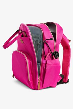 a pink backpack with its contents in the back pocket and zippers on the side