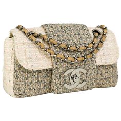 Chanel small cream and grey and multi color tweed with large CC logo and interlocking clasp 2004 {VINTAGE 18 Years} Antique silver hardware Interwoven chain Interior center pocket Interior brown lambskin lining on flap Interior brown nylon graffiti lining Strap Drop: Single 10” Double 9.5” 6”H x 10” W x 2.55” D Made in France Chanel Vintage Bag, Newspaper Bags, Tweed Handbag, Vintage Chanel Handbags, Classic Flap Bag, Chanel Purse, Handbag Heaven, Cheap Handbags, Cheap Bags