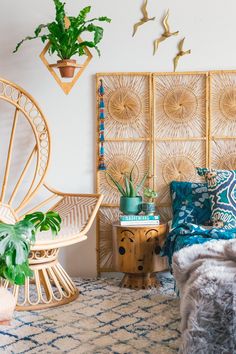 a bedroom with rattan headboard, wicker bed frame and plants on the wall