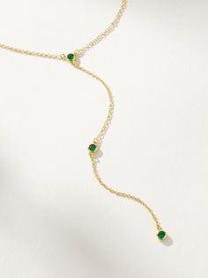 Everyone’s going to be envious that you have this lariat necklace. Crafted with a dainty chain necklace and green gemstones, this is the ultimate layering necklace. Pair the Envious Lariat Necklace with any of our chain necklaces for a stack that gives you some length and instantly makes people look. Want more Y-shaped necklaces? Shop all of our lariat necklaces now. Elegant Adjustable Green Lariat Necklace, Green Lariat Jewelry With Adjustable Chain, Green Lariat Necklace For Gift, Elegant Green Lariat Necklace As Gift, Green Lariat Necklace For Gifting, Green Jewelry With Delicate Chain For Layering, Green Dainty Clavicle Chain Necklace, Green Dainty Chain Necklace, Dainty Green Clavicle Chain Necklace