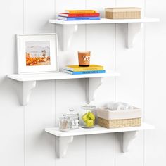 two white shelves with books and drinks on them