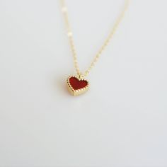 Tiny and dainty red agate heart filled with love and passion, such a perfect present for Valentine's Day and your loved ones. :: Style name: RDHRT-ENLN1034 :: Heart size: 7x7.5mm :: Material: 14k solid yellow gold :: Stone type: red agate Notes :: Jewelries are measured in millimeters and centimeters. :: Please read store policy before placing order. :: In stock items are ready to ship in 3 business days, made to order items are ready to ship in 2-4 weeks. :: International Shipping AVAILABLE. :: Red Dainty Jewelry For Mother's Day, Elegant Red Jewelry With Heart Charm, Red Heart Charm Fine Jewelry, Red Fine Jewelry With Heart Charm, 14k Gold Charm Necklace For Valentine's Day Gift, Dainty Red Charm Necklace For Valentine's Day, Dainty Red Necklace As Gift For Her, Dainty Red Necklace For Her, Dainty Red Necklace For Anniversary