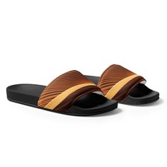 Introducing our Sand Desert Men's Slides, a perfect blend of style and comfort for the modern man. Crafted with meticulous attention to detail, these slides effortlessly combine the rugged charm of the desert with a contemporary design. Ideal for casual outings or lounging by the pool, our Sand Desert Men's Slides are a must-have addition to your footwear collection. Shop now and experience the ultimate comfort and style that our slides have to offer. Men's Slides Product Details:• Strap Comfort Casual Brown Outdoor Slippers, Brown Casual Slippers For Vacation, Outdoor Brown Slippers With Textured Footbed, Brown Casual Slides For Vacation, Casual Brown Slides For Outdoor, Brown Slip-on Slides For Vacation, Casual Brown Outdoor Slides, Casual Brown Slides For Vacation, Casual Brown Open Toe Slides