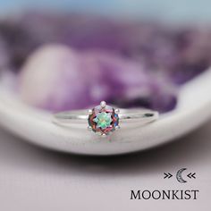 This timeless Mystic Topaz Ring in Sterling Silver features a faceted 6 mm (approximately 1 carat) sparkling rainbow topaz gemstone. This stone is securely held in a six-prong mounting. This has been the archetypical engagement ring style since its introduction in 1886. Although this ring isn't wide enough for our inside ring engraving, it pairs well with many of the other bands we offer. We are happy to offer this ring in a wide number of ring sizes and finish options. When I first began workin Iridescent Birthstone Rings For Gift, Iridescent Gemstone Promise Ring, Iridescent Sterling Silver Crystal Ring For Anniversary, Iridescent Crystal Gemstone Ring For Promise, Iridescent Crystal Ring With Gemstone For Anniversary, Iridescent Crystal Gemstone Ring For Anniversary, Iridescent Round Topaz Ring Gift, Anniversary Iridescent Crystal Ring With Gemstone, Iridescent Sterling Silver Crystal Promise Ring