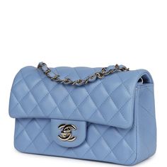 This mini rectangular flap bag is of light blue lambskin leather with light gold tone hardware and has a front flap with signature CC turnlock closure, rear half moon pocket, single interwoven light blue leather and light gold tone chain link shoulder/crossbody strap.The interior is lined in light blue leather and features a zipper pocket with Chanel pull and an open pocket below.Collection: 30-series (2019-2020)Origin: FranceCondition: Never wornAccompanied by: Chanel box, Chanel dustbag, carebook, COA card and feltMeasurements: 7.5" width x 5" height x 2.5" depth; 22.5" strap drop Handbags Aesthetic, Chanel Mini Rectangular, Chanel Handbags Classic, Blue Chanel, Chanel Mini Flap Bag, Small Drawstring Bag, Chanel Clutch, Blue Handbag, Aesthetic Luxury