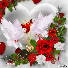 two white doves in the middle of a heart surrounded by red roses and greenery