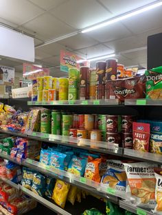 an aisle in a grocery store filled with lots of food and snacks on the shelves