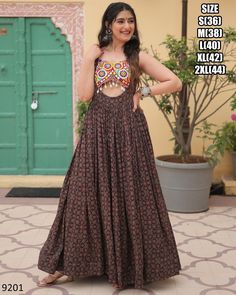 Latest Designer Cotton Printed Kutchi Gamthi Kodi Work Long Anarkali Navratri Gown Collection 2024, Ready To Wear Indian Garba Gown Dress Fabric - Cotton Lining (Inner) - Cotton (Full Up to Bottom) . Type - Readymade Size - S(36), M(38), L(40), XL(42), XXL(44) Work - Printed, Kutchi Gamthi Work And Kodi Lace Length - 56 Inch Flair - 4 Meter Weight - 1 Kg Occasion - Navratri Festival 𝐒𝐞𝐫𝐯𝐢𝐜𝐞𝐬 * Stitching Service Is Available On Customer Demand. Please Get In Touch With Us For Stitching Service. * Beware Of Fake Sellers. We Are Giving Assured Quality. Our Strong Quality Check System Has A 0% Defect Rate. So You Will Always Receive An Excellent Product. * We Also Take Bulk Orders For Weddings And Other Occasions * We Customize Everything When It Comes To Ethnic Wear. * We Also Make Pl Latest Navratri Collection 2024, Bohemian Maxi-length Dupatta, Bohemian Floor-length Anarkali Set With Cutdana, Bohemian Floor-length Anarkali Set With Pallu, Anarkali Style Semi-stitched Maxi Choli, Anarkali Semi-stitched Maxi Length Choli, Anarkali Lehenga With Dabka Work, Sleeveless Anarkali Lehenga With Dabka Work, Anarkali Style Maxi Length Choli For Navratri