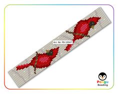 a cross stitch bracelet with two red birds on it