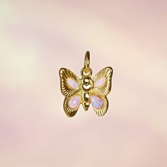 Butterfly Charm - Opal - Add a little magic with our adorable butterfly charm to add to any chain necklace or bracelet. Made with precious lab-grown opals & gold! Wildflower + Co. Jewelry ♥ Measurements: approx. 3/4" h  ♥ Materials: 12k polished gold plating,  & synthetic opals ♥ Designed by & exclusive to Wildflower + Co.  ♥ Lead, nickel & cadmium safe  ♥  Intended for use by adults only  ♥  Imported Butterfly Charm Pendant Necklace As Gift, Butterfly Charm Pendant Necklace For Gift, Cute Silver Jewelry With Butterfly Charm, Cute Butterfly Charm Necklace For Gift, Cute Charm Necklaces As Gift, Mother's Day Butterfly Charm Pendant Necklace, Mother's Day Butterfly Pendant Necklace, Butterfly Charm Jewelry For Birthday, Cute Pendant Charms For Gifts