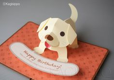 a card with a paper dog on it