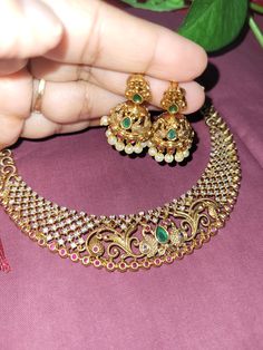 This set has 2 gorgeous earrings with Peacock design with White ,Red and Green Stones necklace unique design set. These Beautiful Gold Platted Necklace is Best for gifting and personal use, You can gift your  Mother, Sister ,Girlfriend, Relatives , Neighbors etc. Suitable for all Occasions. Best to wear on special occasions like Anniversary, Birthday, Diwali and other traditional functions. Green Jewelry Set, South Wedding, Temple Necklace, Green Stone Necklace, Peacock Necklace, Stones Necklace, Beautiful Peacock, Green Stones, Peacock Design