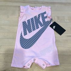 Nike Baby Girl Onesie Outfit. Brand New With Tag - Never Worn. 6m Size. Light Pink With Gray Print. Pink Onesie With Letter Print For First Birthday, Pink Onesie For Summer, Pink Cotton Onesie For Playwear, Pink Cotton Onesie For Spring, Pink Fitted Onesie For Playtime, Playful Pink Onesie For Playwear, Playful Pink Short Sleeve Onesie, Playful Pink Onesie With Letter Print, Casual Pink Onesie For Playtime