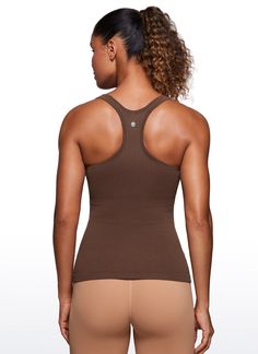 Seamless collection of smooth, breathable fabric is designed to help reduce chafing, encourage ventilation and wick away sweat to help you stay dry. Y-back and scoop neck gives you a stylish look. Built in shelf bra with removable pads provides extra support. Feature & Fitting: 
 Seamless collection 
 Design for yoga 
 Y-back 
 Built in bra & removable pads 
 Fabric: 
 Chafe-free, seamless construction 
 Sweat-wicking, soft ribbed textured fabric 
 Lightweight and stretchy 
 Body: 100% P Training Tops With Built-in Bra In Seamless Fabric, Stretch Ribbed Racerback Sports Bra, High Stretch Tops With Built-in Bra In Seamless Fabric, Stretch Seamless Sports Bra With Scoop Back, Solid Supportive Seamless Tank Top, Supportive Seamless Solid Tank Top, Ribbed Stretch Racerback Activewear, Ribbed Medium Support Tank Top For Sports, Medium Support Ribbed Tank Top For Sports