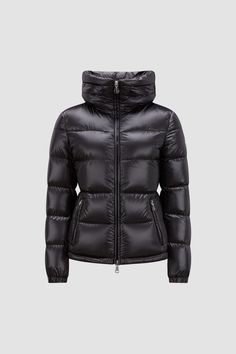 A modern take on a classic puffer, the Douro down jacket presents tactical quilting designed to enhance the silhouette. The short puffer is crafted from recycled longue saison, a nylon fabric notable for providing supreme warmth while maintaining a light weight. The jacket is finished with a practical pull-out hood hidden in the stand collar. Women Puffer Jacket, Womens Moncler Jacket, Luxury Hooded Nylon Puffer Jacket, Luxury Black Puffer Jacket With Zipper Closure, Moncler Maya 70 Short Down Jacket, Black Luxury Puffer Jacket With Double-lined Hood, Moncler Women, Down Jackets, Nylon Fabric