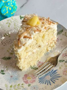 a piece of pineapple coconut cake on a plate with a fork