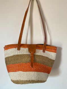 This listing is for size 10 by 10 inches tote sisal basket that has been carefuly handwoven by skilled women in Kenya. it can be used as a beach basket, and a all carry day kinda bag Dimensions Height 10 inches Width 10 inches We ship via DHL which takes 3-5 days To continue shopping click on the link below https://www.etsy.com/shop/TweetieAfrica?ref=seller-platform-mcnav Handwoven Jute Bucket Bag Basket, Weaving Straw Bucket Bag For Market, Bucket Straw Bag With Weaving For Market, Handwoven Jute Basket Bucket Bag, Market Bucket Straw Bag With Weaving, Brown Basket Crochet Bag With Leather Handles, Brown Crochet Basket Bag With Leather Handles, White Handwoven Basket Shoulder Bag, Jute Basket Beach Bag