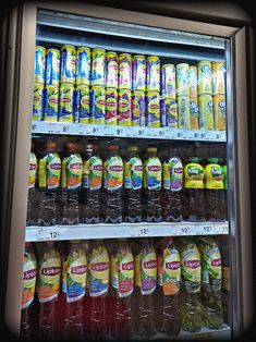 a refrigerator filled with lots of different types of drinks