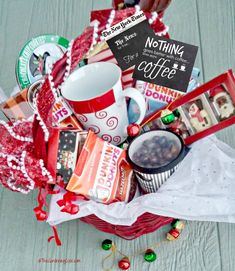 a basket filled with coffee, candy and other items