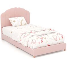 a bed with pink headboard and foot board